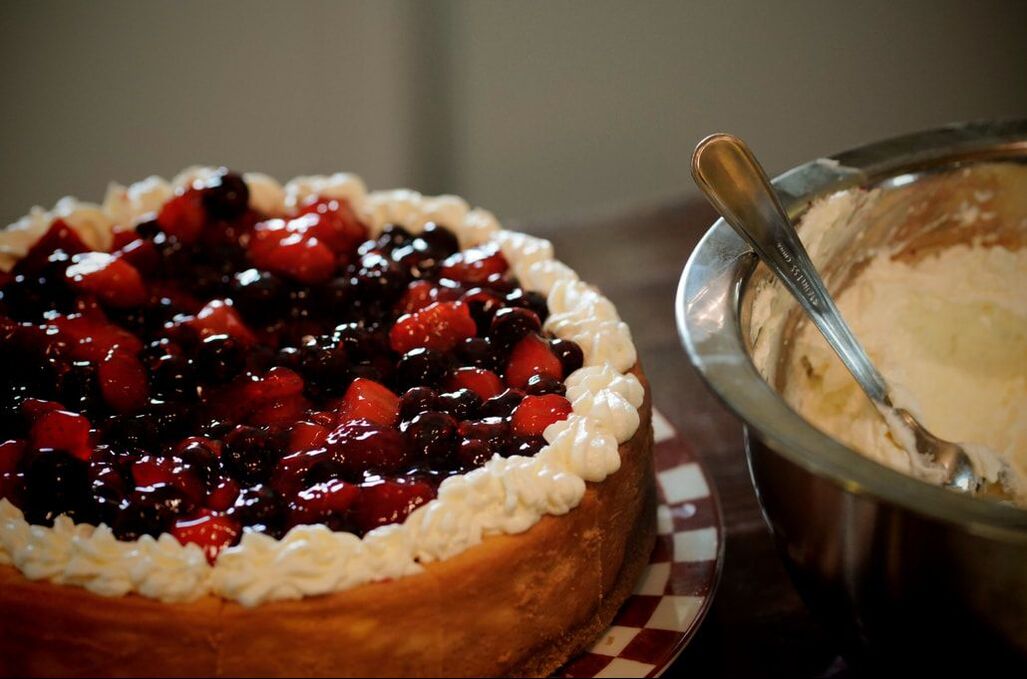 Photo of a house-made cheesecake with berry topping